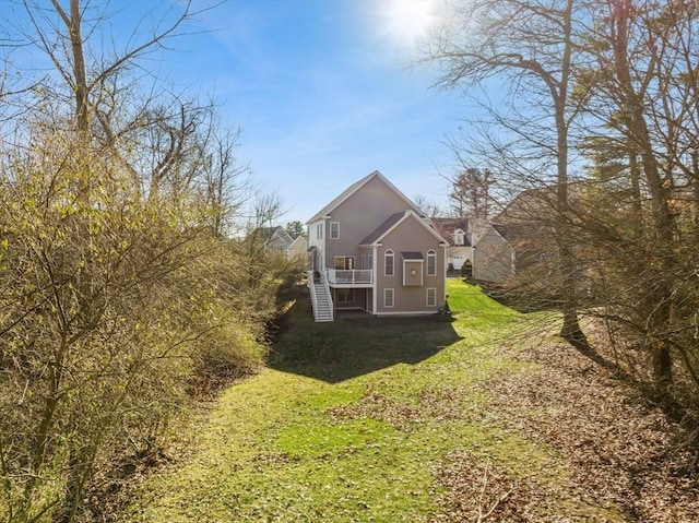 view of side of home featuring a lawn