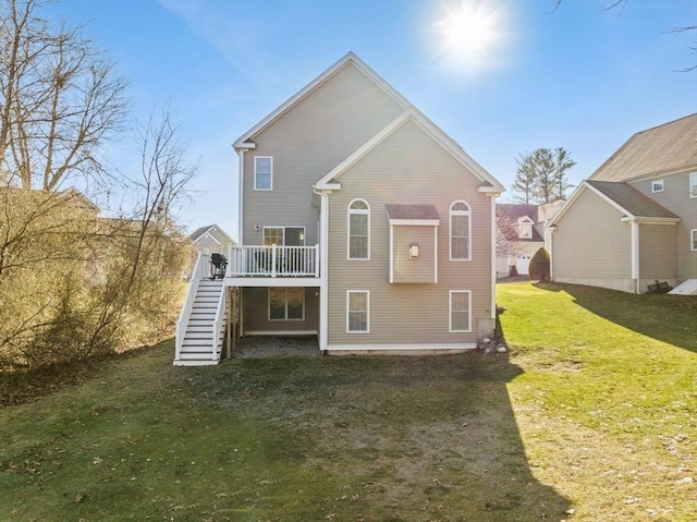 rear view of property featuring a yard