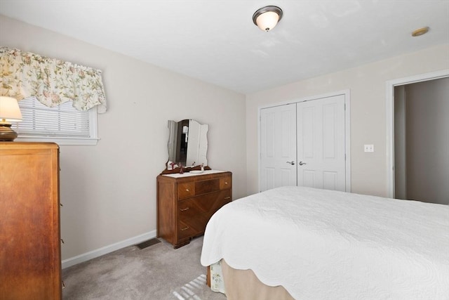 carpeted bedroom featuring a closet