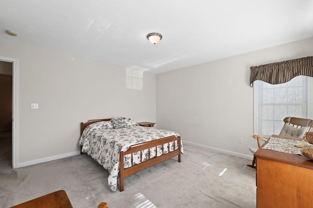 bedroom with light colored carpet