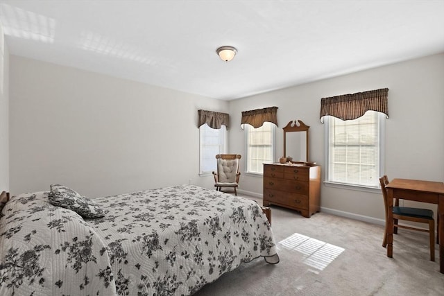 bedroom with light colored carpet