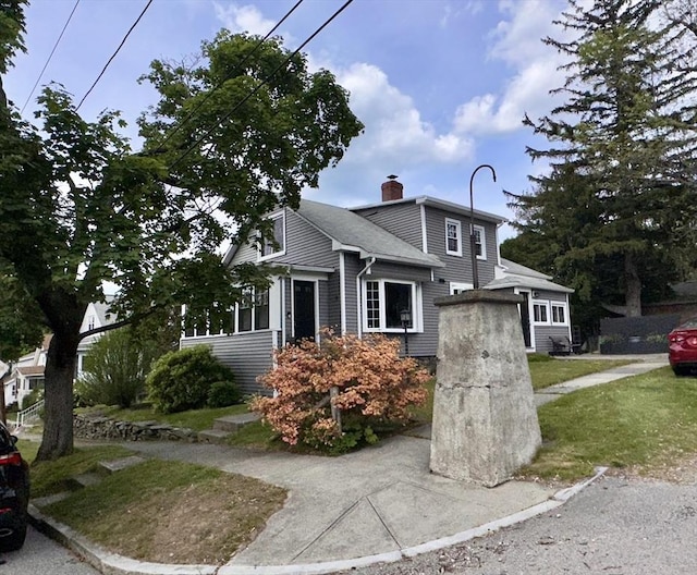 11 Dallas St, Worcester, MA 01604 - split level home featuring a chimney and a front lawn