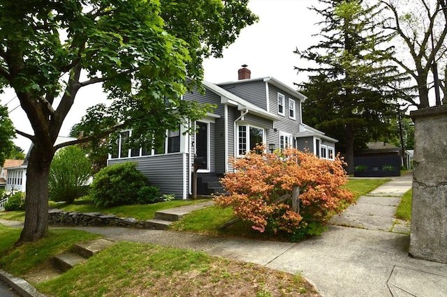 11 Dallas St, Worcester, MA 01604 - view of front of house featuring a chimney and a front lawn