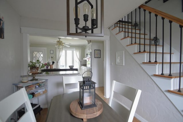 11 Dallas St, Worcester, MA 01604 - dining area featuring wood finished floors, ceiling fan, and stairs