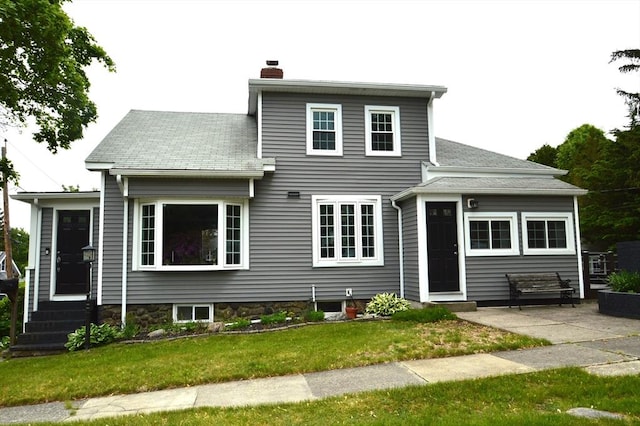 11 Dallas St, Worcester, MA 01604 - view of front of house featuring a chimney, a front yard, and entry steps