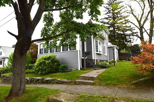 11 Dallas St, Worcester, MA 01604 - view of front of house featuring a front lawn and a chimney