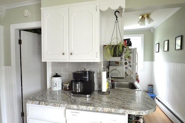 11 Dallas St, Worcester, MA 01604 - kitchen featuring baseboard heating, a sink, ornamental molding, white cabinetry, and dishwasher