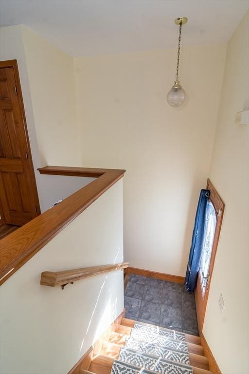 staircase with tile patterned floors