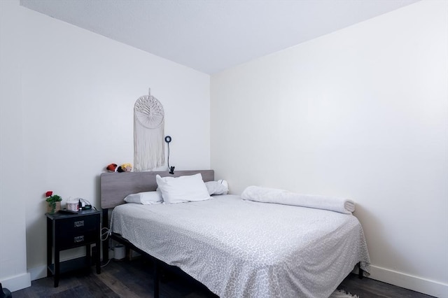 bedroom featuring dark hardwood / wood-style floors