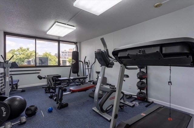 workout room with a textured ceiling