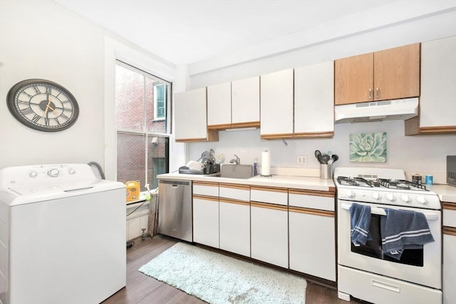 kitchen featuring white gas range, washer / clothes dryer, under cabinet range hood, stainless steel dishwasher, and a sink