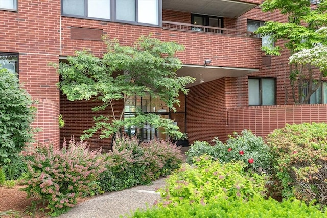 view of side of property with a balcony