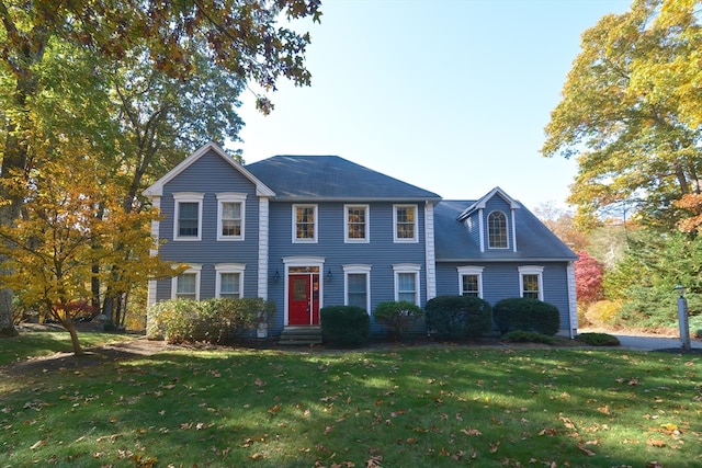 colonial-style house with a front yard