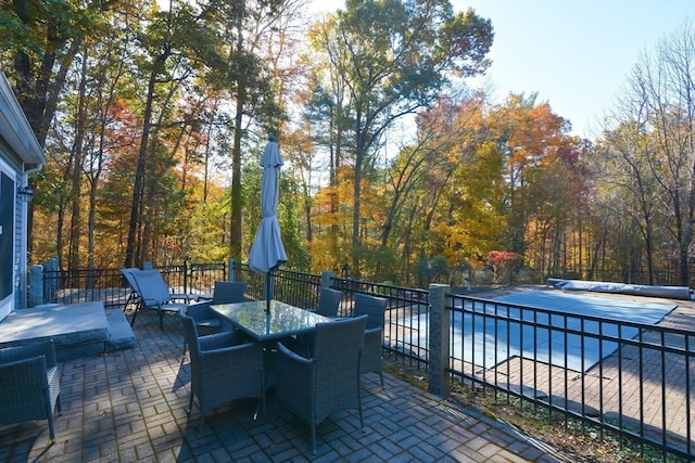 view of patio with a covered pool