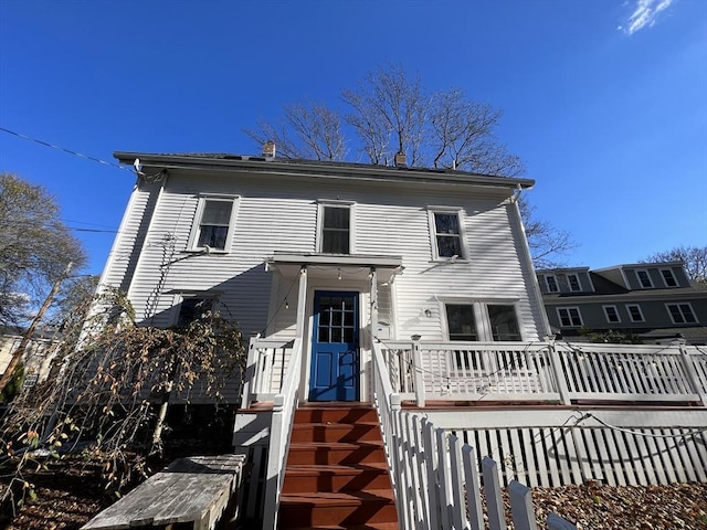 18 Rushmore St, Boston, MA 02135 - view of front of property featuring a wooden deck