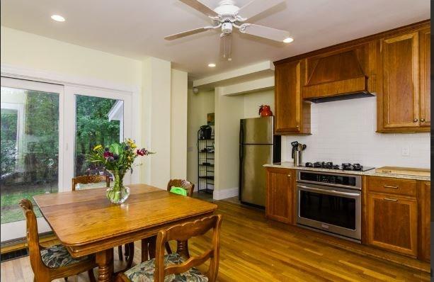 18 Rushmore St, Boston, MA 02135 - kitchen featuring stainless steel appliances, custom range hood, a ceiling fan, recessed lighting, and dark wood finished floors