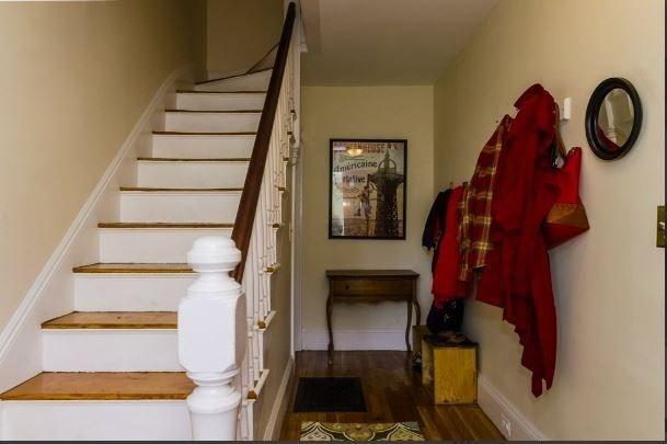 18 Rushmore St, Boston, MA 02135 - staircase with wood finished floors