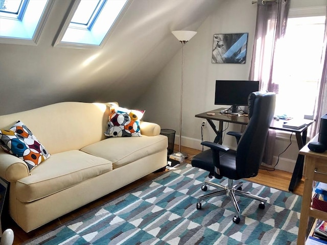 18 Rushmore St, Boston, MA 02135 - office area with a skylight, wood finished floors, lofted ceiling, and baseboards
