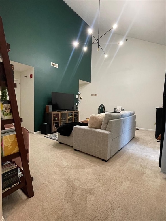 living room featuring high vaulted ceiling and light colored carpet