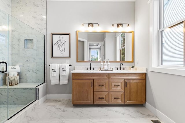 bathroom featuring vanity and a shower with door