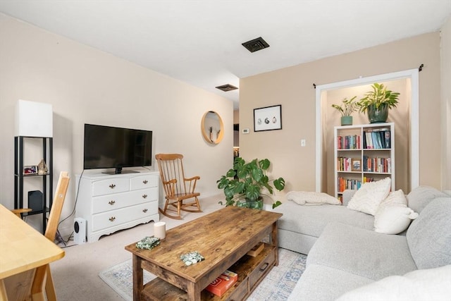 living area featuring light colored carpet