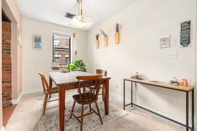 dining room with baseboards