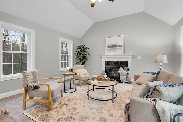 carpeted living room featuring plenty of natural light, ceiling fan, and vaulted ceiling