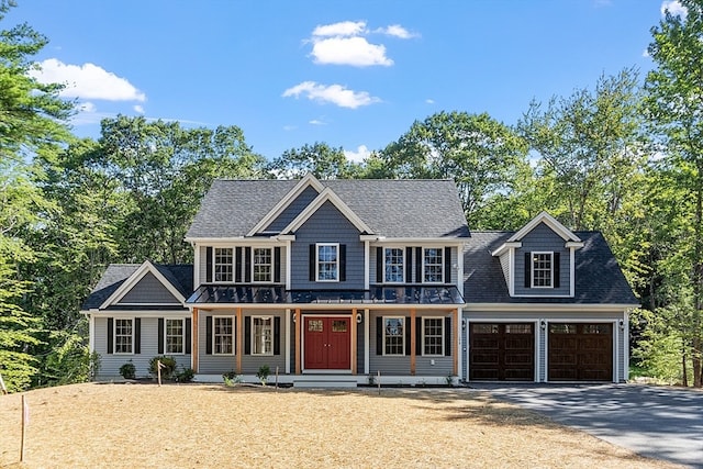 view of front of home featuring covered porch and a garage