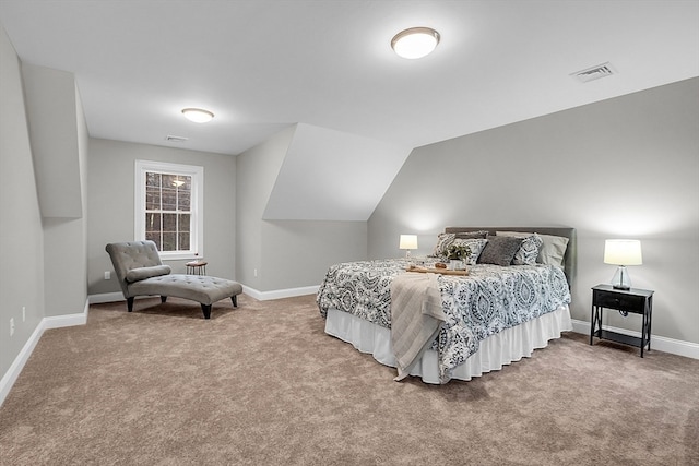 bedroom featuring carpet floors and vaulted ceiling