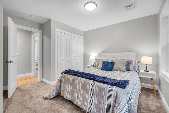 carpeted bedroom featuring a closet