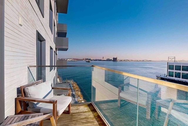 balcony featuring a water view