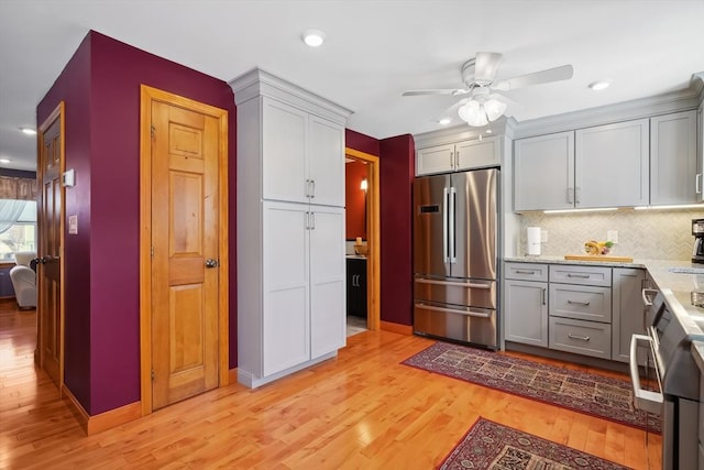 241 Broadway Rd Unit 56, Dracut, MA 01826 - kitchen with stainless steel fridge, light wood-style floors, ceiling fan, backsplash, and recessed lighting