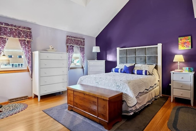241 Broadway Rd Unit 56, Dracut, MA 01826 - bedroom featuring wood finished floors and high vaulted ceiling