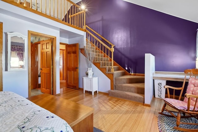 241 Broadway Rd Unit 56, Dracut, MA 01826 - stairs with wood finished floors and a high ceiling