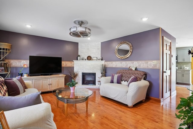241 Broadway Rd Unit 56, Dracut, MA 01826 - living area featuring a fireplace, light wood-style floors, recessed lighting, and ceiling fan