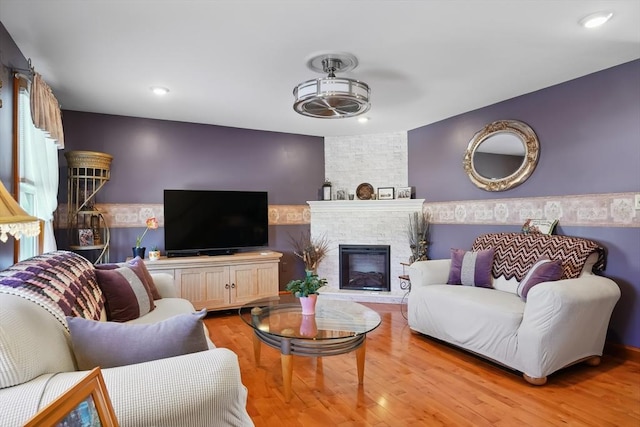 241 Broadway Rd Unit 56, Dracut, MA 01826 - living area with a stone fireplace, wood finished floors, and recessed lighting