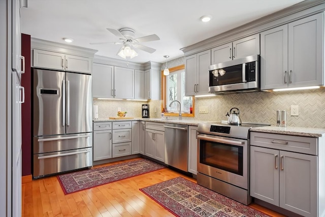 241 Broadway Rd Unit 56, Dracut, MA 01826 - kitchen with appliances with stainless steel finishes, gray cabinetry, ceiling fan, light wood-style floors, and recessed lighting