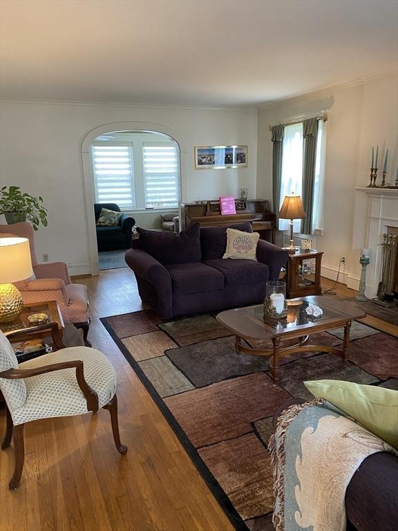 452 W Clinton St, New Bedford, MA 02740 - living room featuring hardwood / wood-style flooring, plenty of natural light, and baseboards