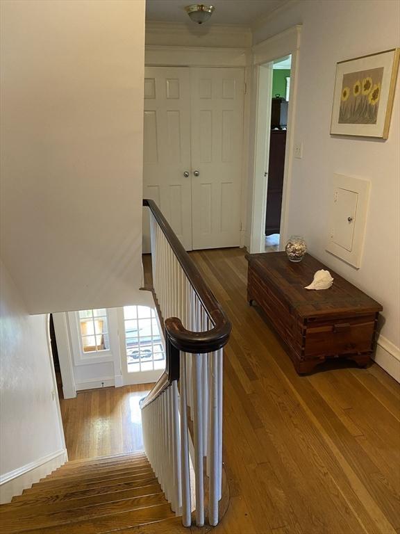 452 W Clinton St, New Bedford, MA 02740 - staircase with wood finished floors and baseboards