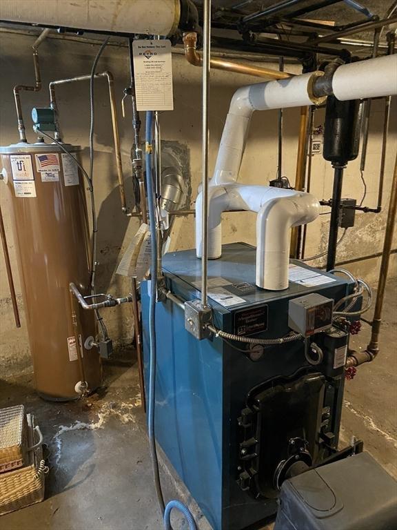 452 W Clinton St, New Bedford, MA 02740 - utility room featuring gas water heater and a heating unit