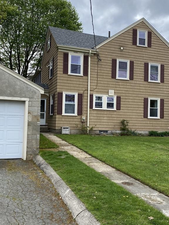 452 W Clinton St, New Bedford, MA 02740 - townhome / multi-family property featuring a shingled roof and a front yard