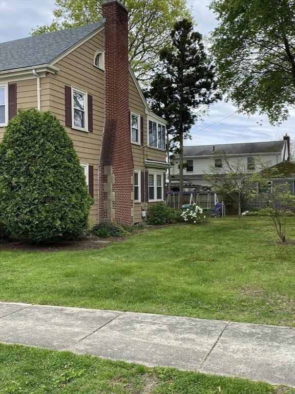 452 W Clinton St, New Bedford, MA 02740 - view of side of home featuring a chimney and a shingled roof
