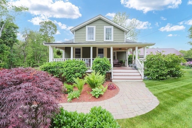 21 Witherell Pl, Plainville, MA 02762 - farmhouse-style home featuring a porch and a front lawn