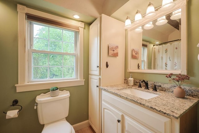 21 Witherell Pl, Plainville, MA 02762 - bathroom with plenty of natural light, vanity, toilet, and baseboards