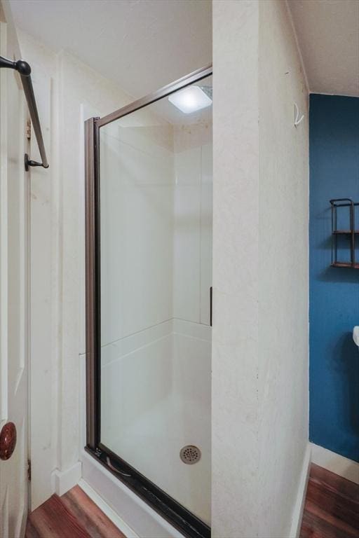 21 Witherell Pl, Plainville, MA 02762 - full bathroom with a shower stall, wood finished floors, and baseboards
