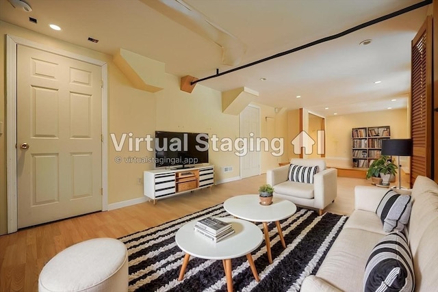 21 Witherell Pl, Plainville, MA 02762 - living room with wood finished floors, baseboards, and recessed lighting
