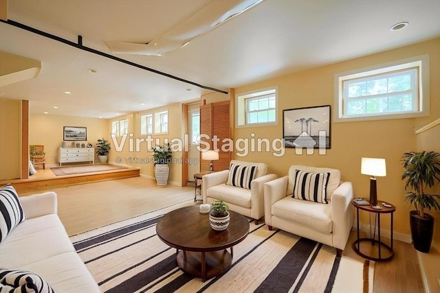 21 Witherell Pl, Plainville, MA 02762 - living area featuring baseboards, wood finished floors, and recessed lighting