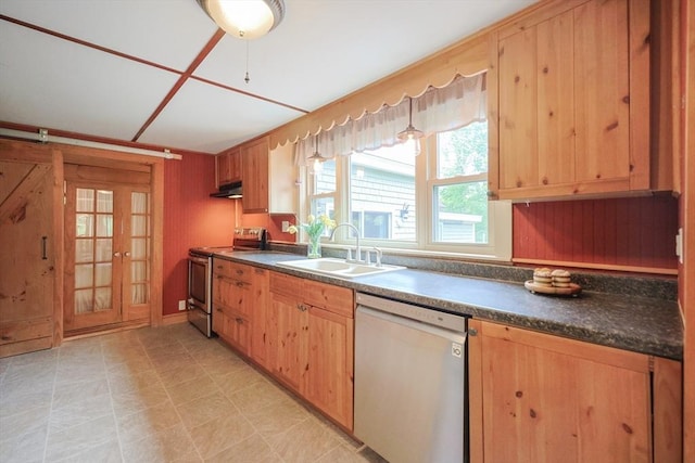 21 Witherell Pl, Plainville, MA 02762 - kitchen with stainless steel appliances, a sink, under cabinet range hood, dark countertops, and wooden walls