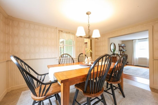 21 Witherell Pl, Plainville, MA 02762 - dining room with a chandelier, wallpapered walls, baseboards, and ornamental molding