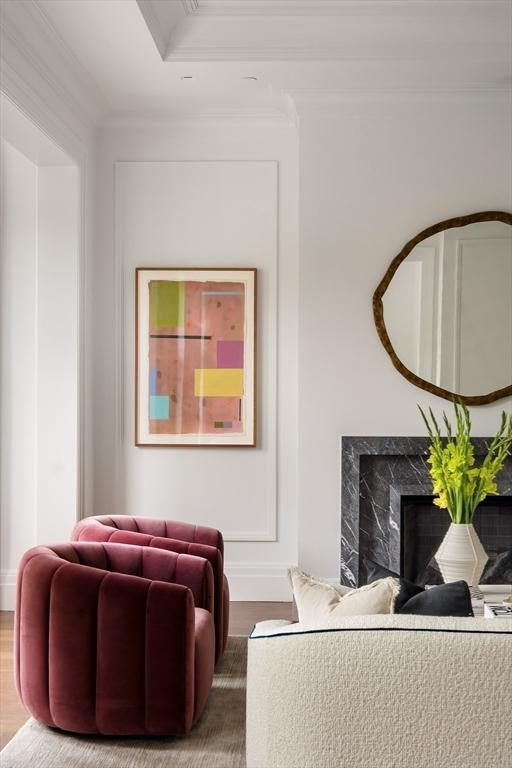 240 Commonwealth Ave Unit 2, Boston, MA 02116 - living area featuring ornamental molding, wood finished floors, and a fireplace